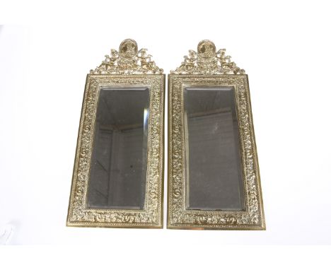 A PAIR OF FLEMISH BAROQUE STYLE BRASS MIRRORS, 19TH CENTURY, rectangular with bevelled mirror plates, the crests cast with a 