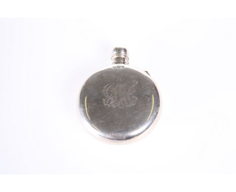 A VICTORIAN SILVER HIP FLASK, GEORGE W. ADAMS, LONDON 1877, circular with screw cover, engraved with a monogram to one side. 