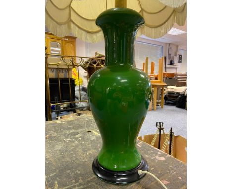 An large green porcelain table lamp in an oriental manner. 