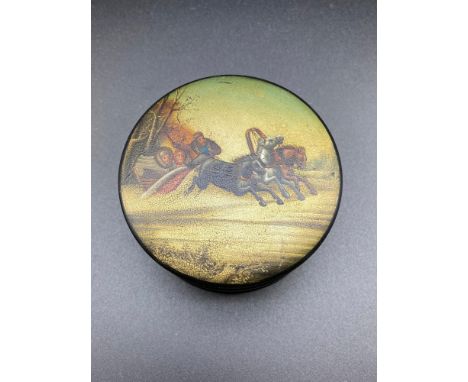 A 19th century Russian Paper mache snuff box. Designed with a hand painted lid depicting three horses pull a sledge in the sn