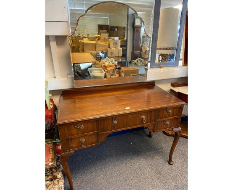 A Vintage Mahogany dressing table designed with queen anne legs, 5 under drawers and mirror back. 