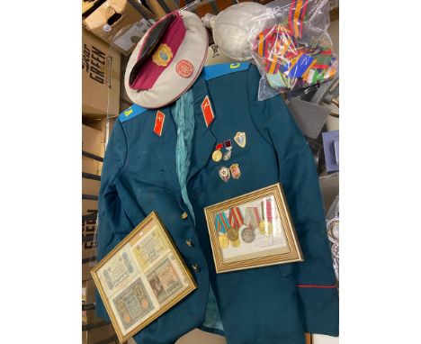 A Military jacket, Hat, water flask, ribbons, framed medals and framed bank notes 