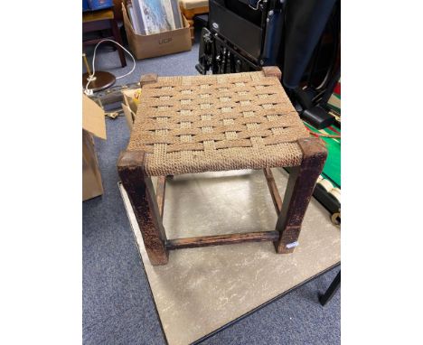 A Vintage weaved top stool 