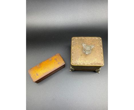 An Antique paper mache snuff box together with a vintage musical trinket box. 