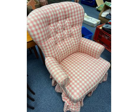 An antique button back bedroom arm chair 