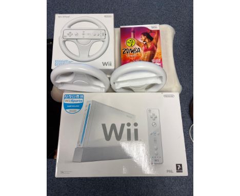 Nintendo Wii console, Wii fit pad and Zumba game. 