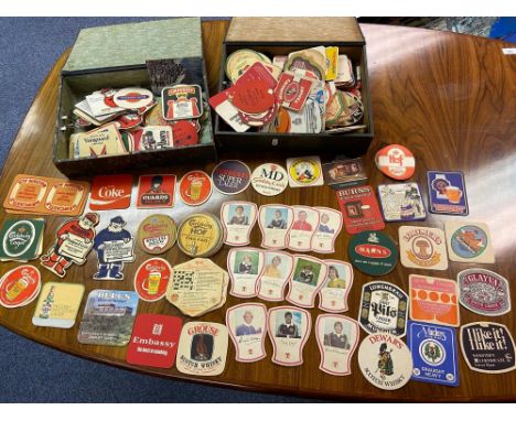 Two tubs containing a collection of vintage pub advertising beer mats to include Tennent's Scottish football player mats, Coc