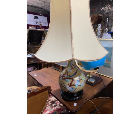 A Large rise and fall design cloisonné table lamp, sat upon a hard wood stand. In a working condition. 