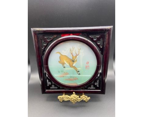 A Chinese framed silk tapestry of a stag. Signed by the artist. [Measures 21x21cm] 