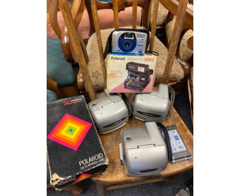 A Collection of vintage Polaroid cameras 
