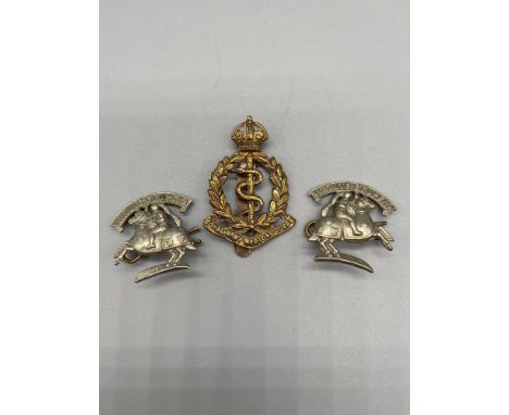 A Pair of Virtue et opera neck cuff badges and a Royal Army Medical Corps cap badge. 