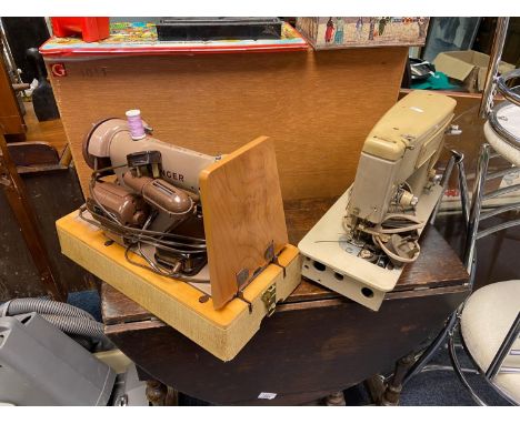 Two vintage Singer Sewing machines 