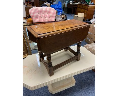 A vintage oak drop end side table. 