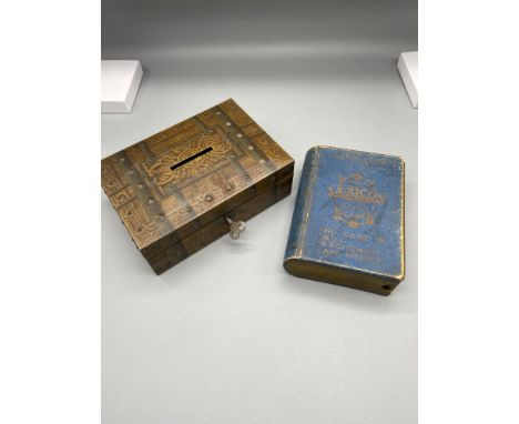 A Vintage tin bank with key together with Lexicon card game. 