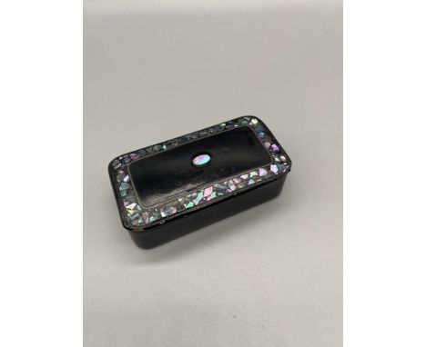 A Victorian snuff box designed with paua shell inlays. 