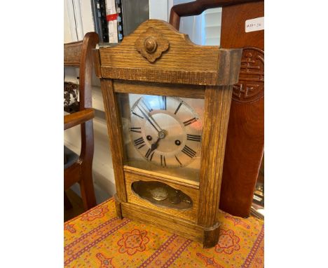 An Antique mantle clock. Comes with a key and pendulum. 