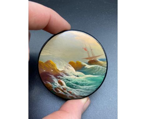 A Vintage Russian paper mache pill box. Depicting crashing waves against the rocks. [6cm in diameter] 