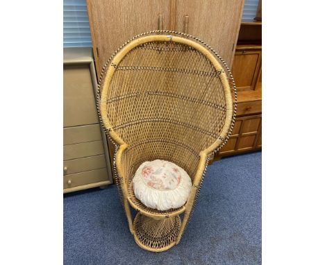 A Large vintage peacock bedroom wicker chair 