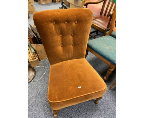 A Vintage button back bedroom chair designed on queen anne legs. 
