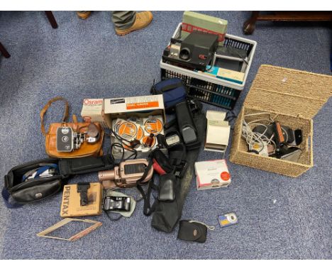 A Large collection of Cameras and equipment to include Pentax digital camera, Bolex Naillard cine camera and various projecto