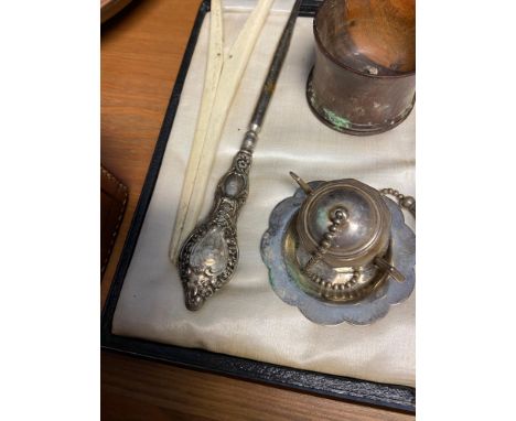 Various collectables which include Silver handle button hook, Copper hot water bottle and possible silver sugar shaker. 