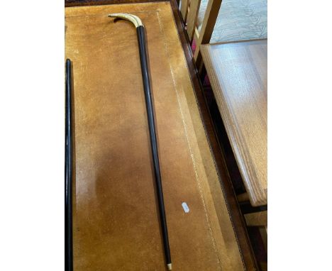 A 19th century walking stick designed with a horn handle 