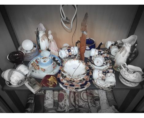 A shelf of Collectables to include China Ware, mona tea set, coalport figure evening at the opera est 