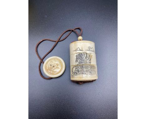 A Japanese bone carved inro designed with a tiger to each side. Finished with a bead and a Manju Netsuke disc. [5.5cm in leng
