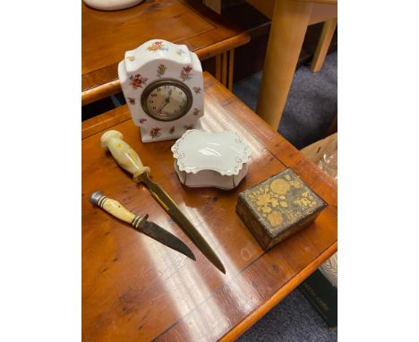 Onyx handle letter opener, small hunting knife, Antique porcelain cased clock, trinket dish and arts and crafts trinket box. 