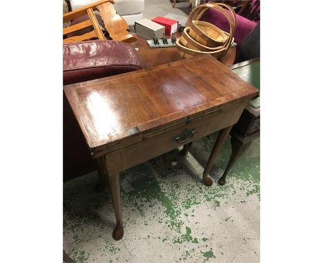 A Mahogany card table with concertina legs