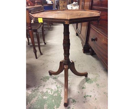 Georgian octagonal and segmented veneer top wine table on tri leg pedestal base.