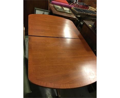 Reproduction dining table on two pedestal legs.