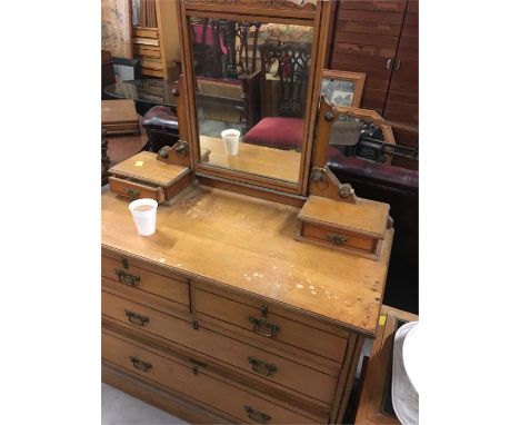 A pine dressing table with two drawers over two 