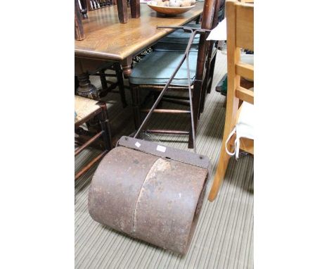 A cast iron garden roller