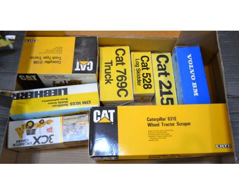 Eight various boxed Diecast vehicles to include Caterpillar 631E Wheel Tractor Scraper, Caterpillar D10N Track-Tyre Tractor, 