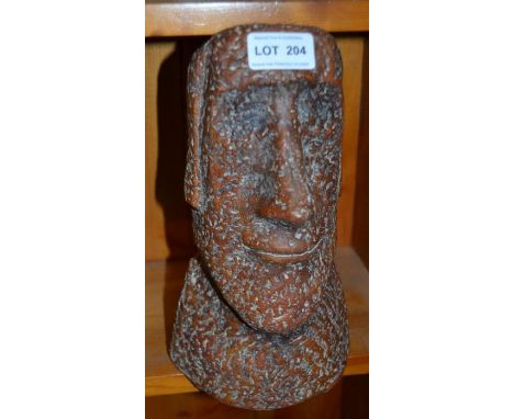 A clay / pottery model of an Easter Island style sculpture of a head
