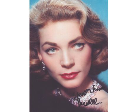 Lauren Bacall signed stunning 6 x 4 colour head and shoulders portrait photo.  Good condition. All autographs come with a Cer