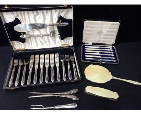 A GEORGE V SILVER HANDLED FISH EATING SET for six, with servers, Sheffield 1936, maker C Beaston (cased), six silver handled 