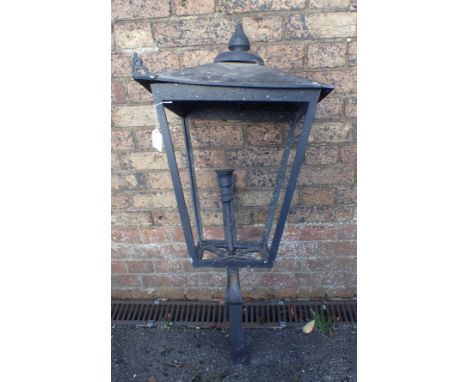 AN OUTDOOR WALL LANTERN in the style of a gas street light (corner casting missing, no glazing)