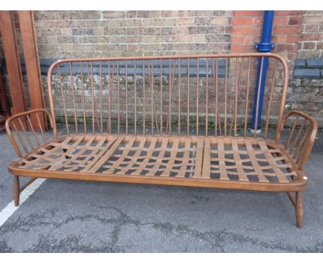 AN ERCOL STICK-BACK THREE-SEATER SOFA 197cm wide (sold as a frame, with cushions available for pattern)