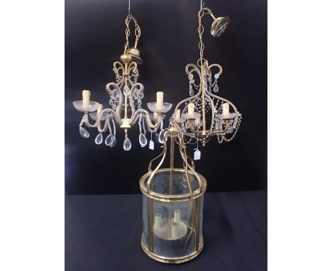 A BRASS-FRAMED HALL LANTERN of cylindrical form,52cm high, 26cm dia, and two beaded chandeliers (one with a damaged drip tray