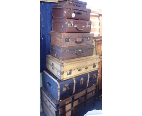 A VICTORIAN WOODEN-BOUND TRAVELLING TRUNK with iron reinforcements, 98cm wide, and a variety of vintage luggage (8)