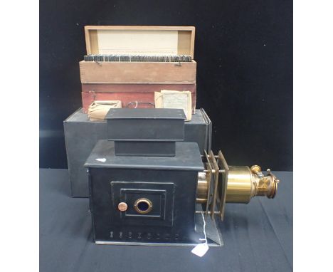 A TINPLATE AND BRASS MAGIC LANTERN, WITH SLIDES including an 'Aladdin or the Wonderful Lamp' box, cases containing views in I