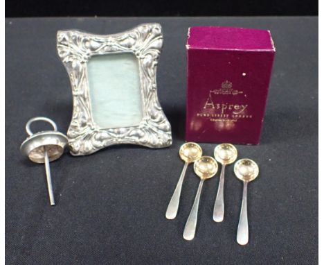 ASPREY: A &amp; Co. FOUR SILVER SALT SPOONS, LONDON 1975 in an Asprey box, a silver photo frame and a silver bottle stopper b