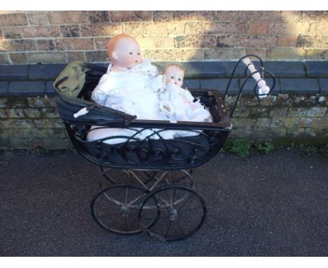 A VICTORIAN STYLE DOLL'S PRAM, AN A M GERMANY BISQUE HEAD DOLL 351/8K, 48cm high, and a smaller plastic doll (3)