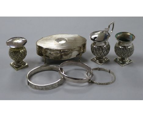 An Edwardian silver trinket box, three silver bangles and an EPNS cruet set.