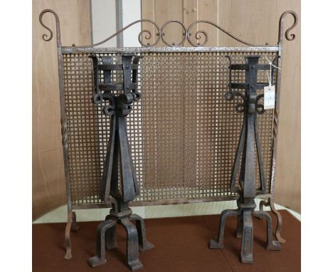 A pair of wrought iron firedogs and a firescreen W.85cm