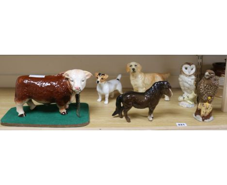 A Melba ware bull and four Beswick figures and another