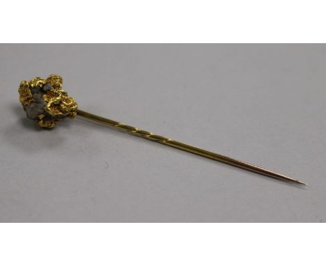 A yellow metal 'nugget' stick pin (tests as 22ct gold), 7.3g