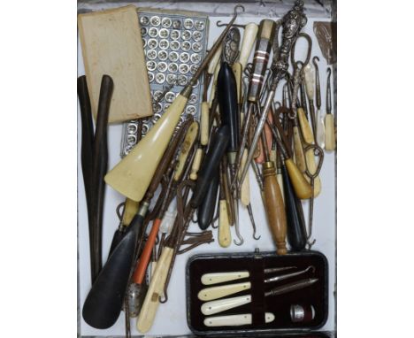 A collection of button hooks, etc.